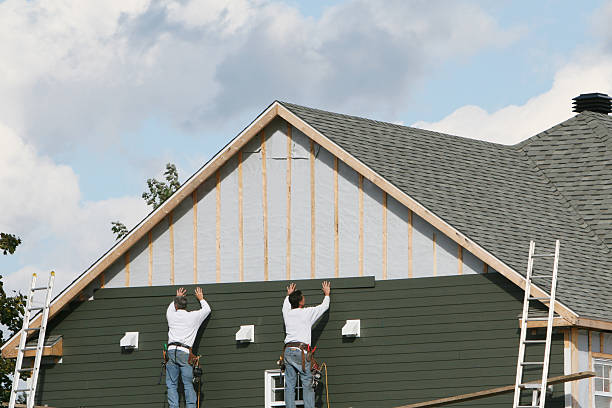 Professional Storm Damage Siding Repair technician working in Adena, OH